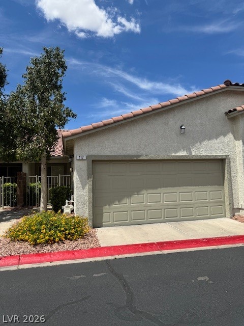117 Tapatio Street Henderson, NV 89074 - Photo 2 of 14 This charming home offers convenient garage access and a well-maintained exterior.