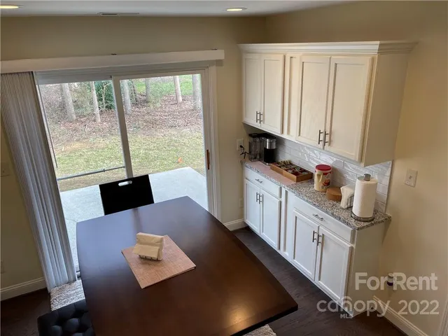 workspace with wooden floor and windows