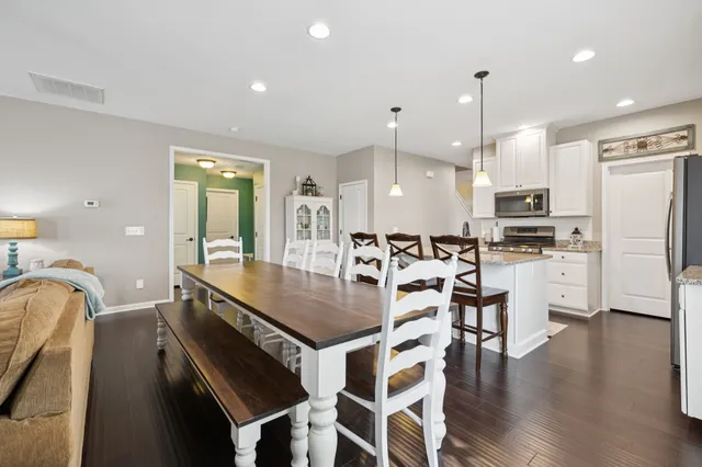 a view of a livingroom with furniture and a flat screen tv