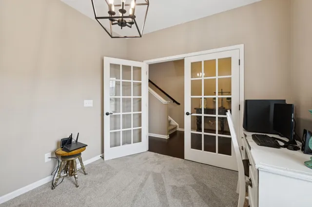 a view of a hallway with wooden floor and entryway
