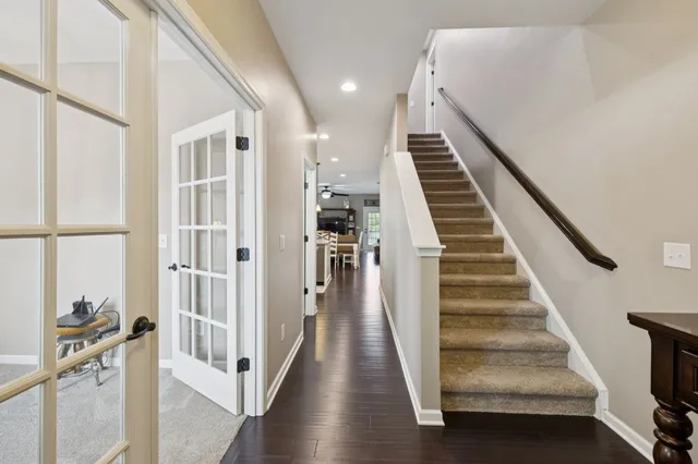 a bathroom with a granite countertop sink a mirror and a shower