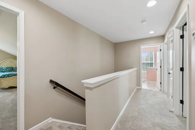 a bedroom with a bed and a ceiling fan