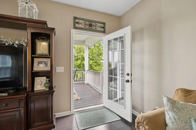 a view of a roof deck with furniture