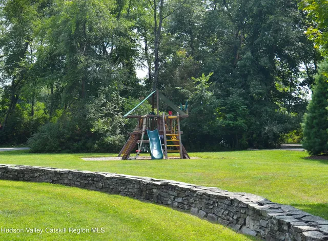 a view of a park with large trees