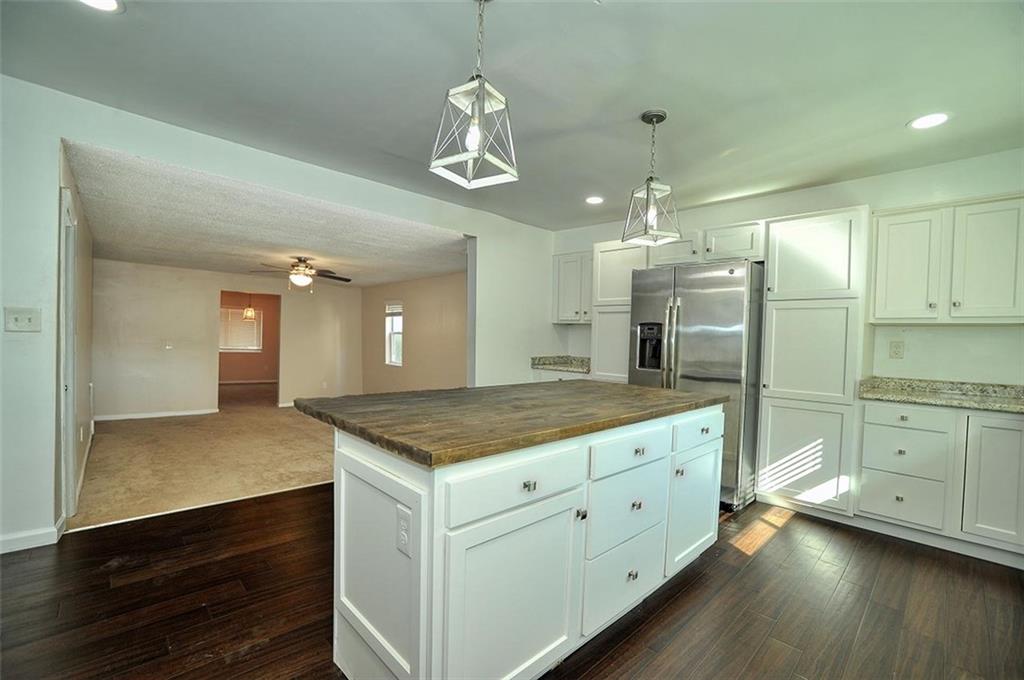 412 Colton Street Pittsburgh, PA 15209 - Photo 6 of 18 a bathroom with a granite countertop sink and a refrigerator