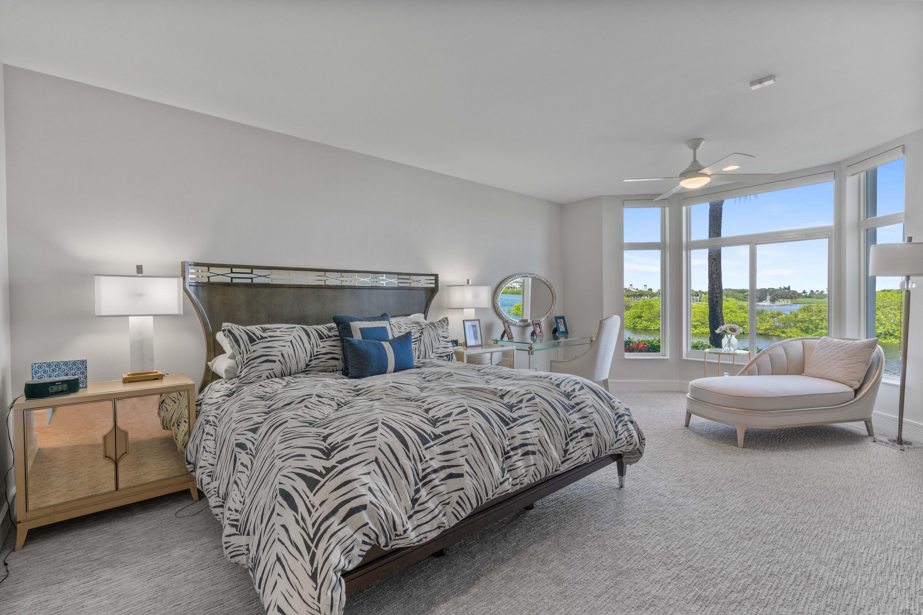 266 Eagle Drive Jupiter, FL 33477 - Photo 13 of 35 a bedroom with a bed and a couch