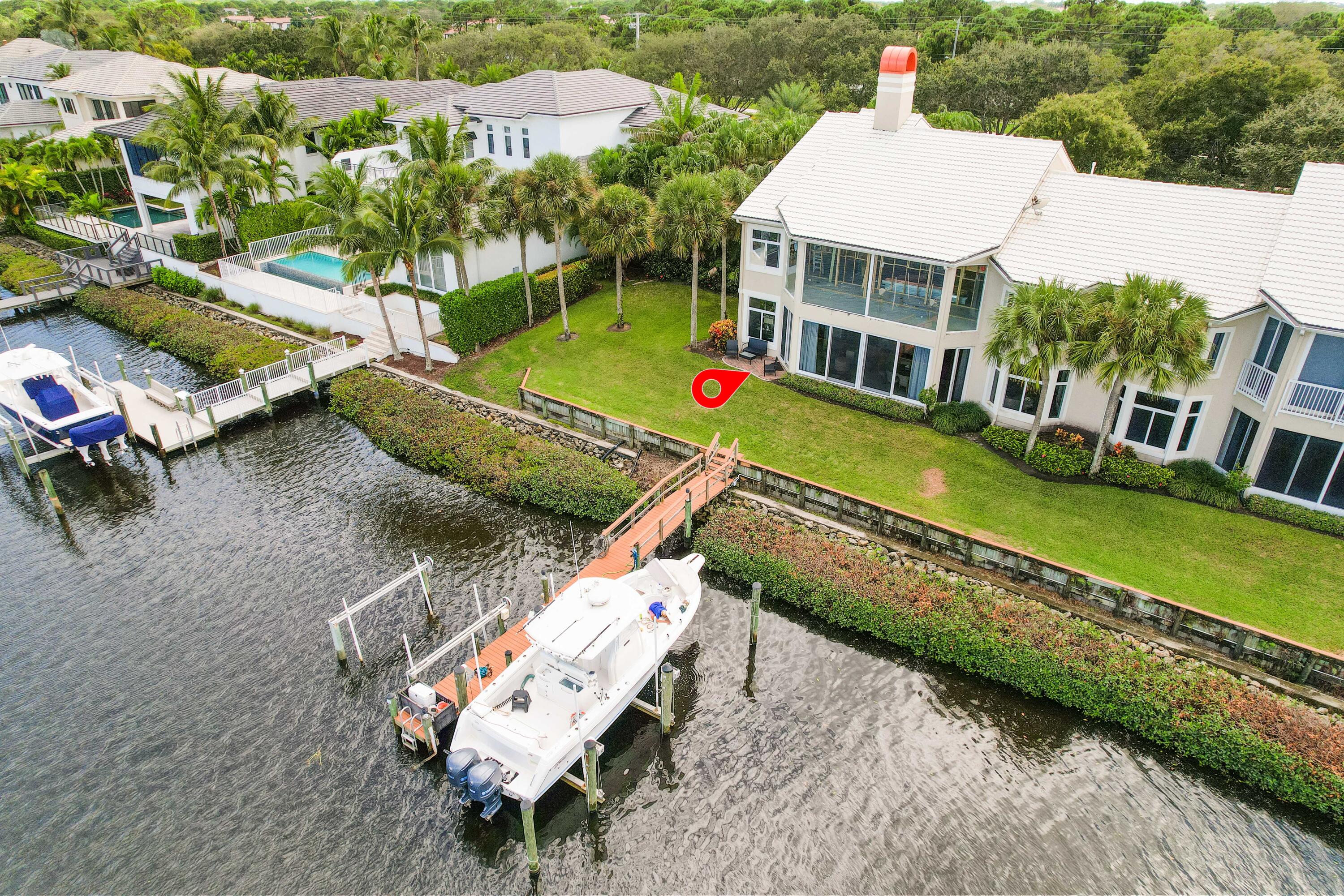 266 Eagle Drive Jupiter, FL 33477 - Photo 22 of 35 an aerial view of a house with a yard