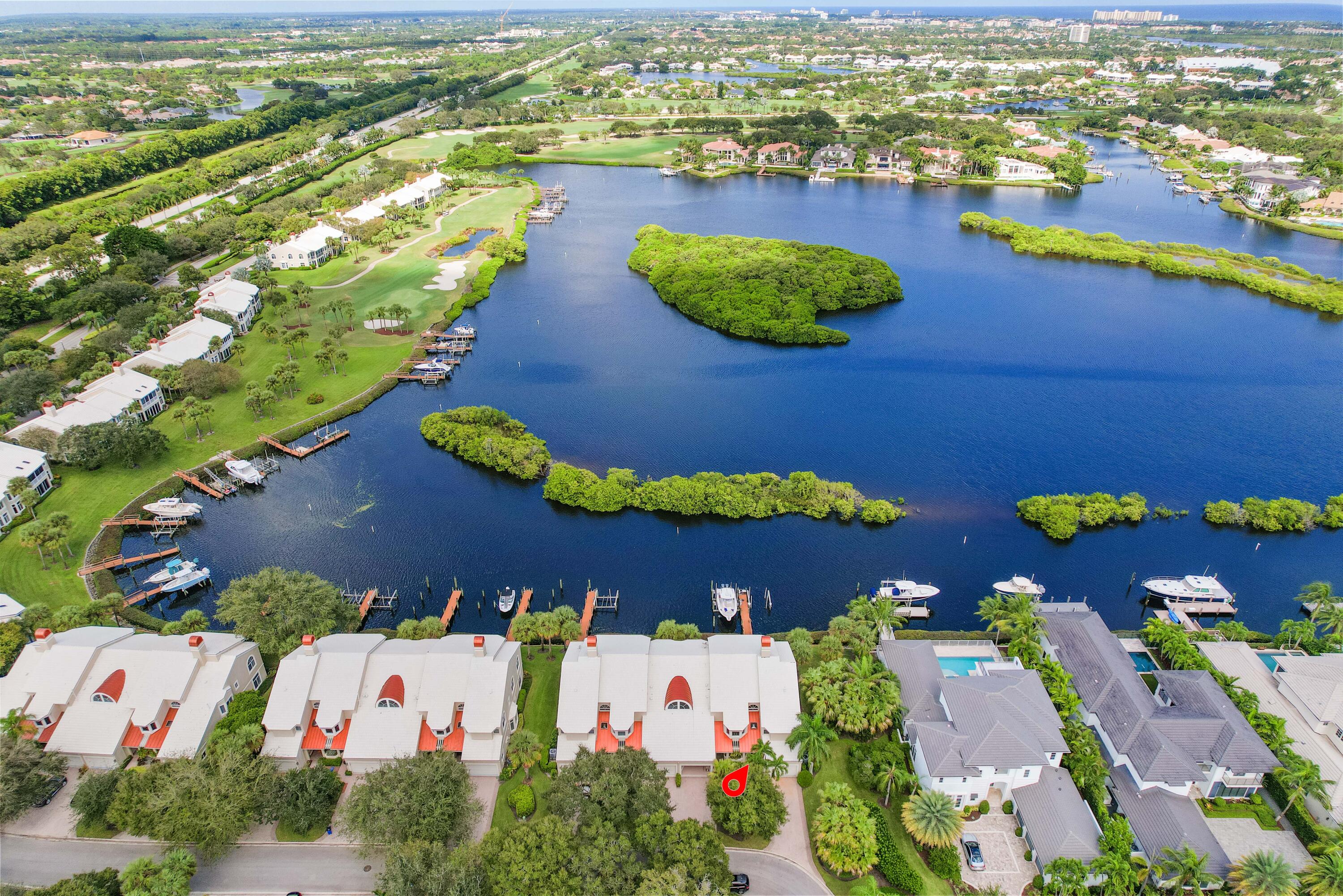 266 Eagle Drive Jupiter, FL 33477 - Photo 23 of 35 an aerial view of residential houses with outdoor space