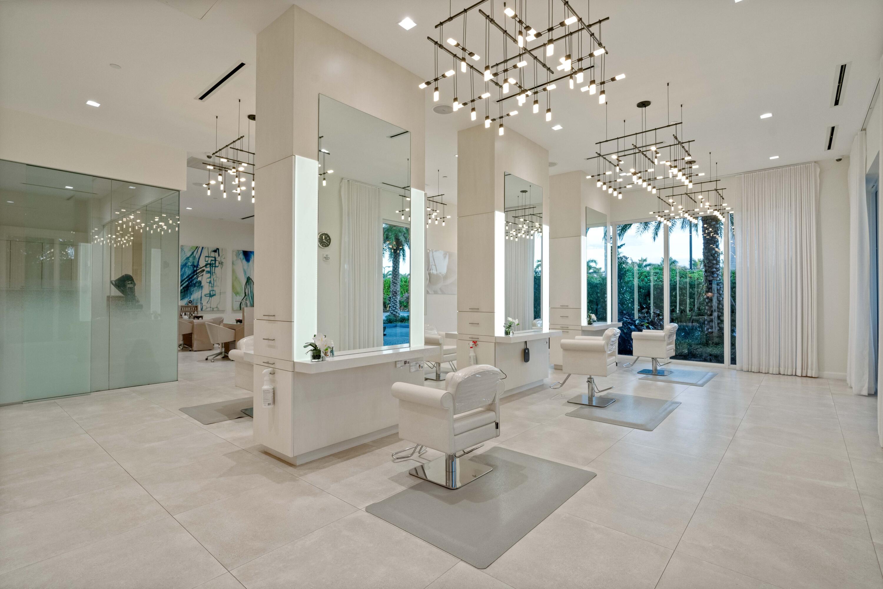 266 Eagle Drive Jupiter, FL 33477 - Photo 31 of 35 a living room with patio furniture and a chandelier