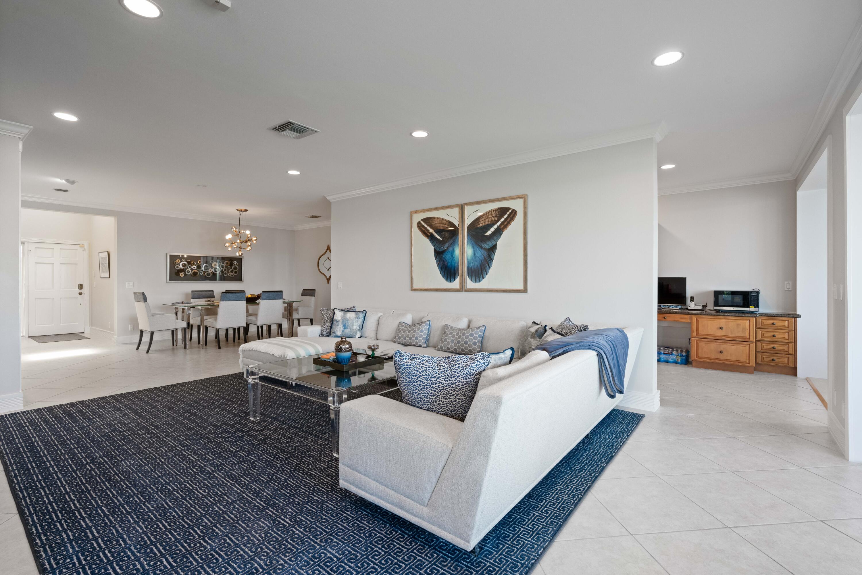 266 Eagle Drive Jupiter, FL 33477 - Photo 5 of 35 a living room with furniture and kitchen view