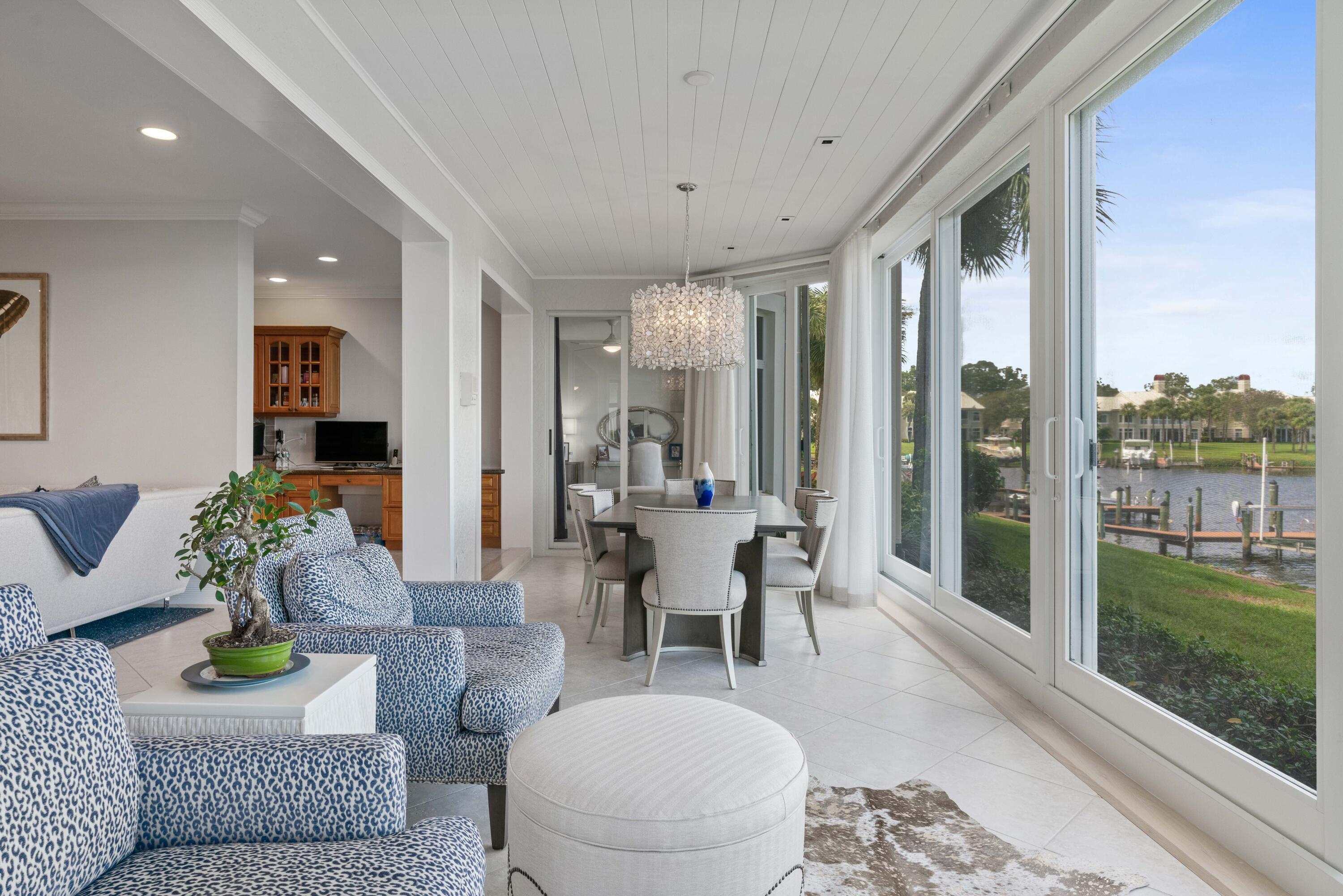 266 Eagle Drive Jupiter, FL 33477 - Photo 10 of 35 a living room with furniture and a large window