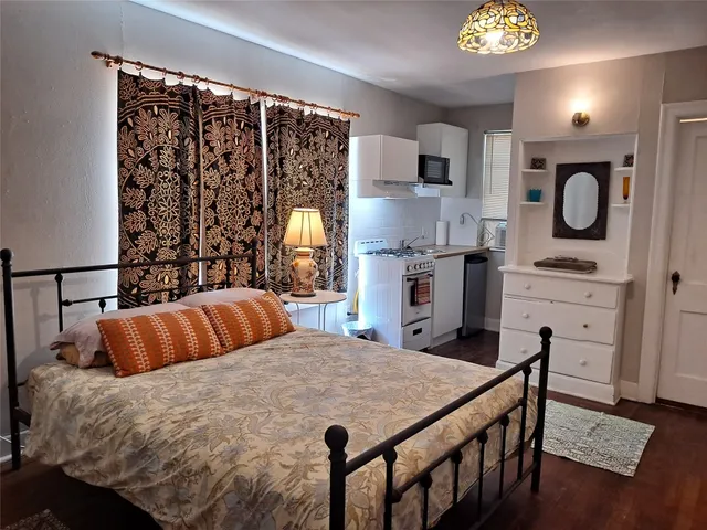 a bedroom with a bed and a table in it