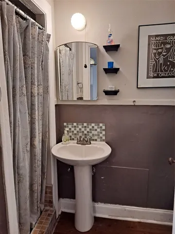 a bathroom with a sink and a mirror
