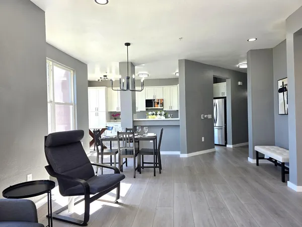 a view of a dining room with furniture and wooden floor