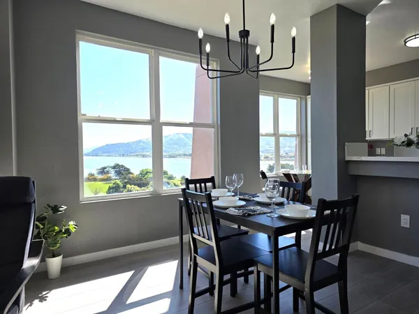 a view of a dining room with furniture window and outside view