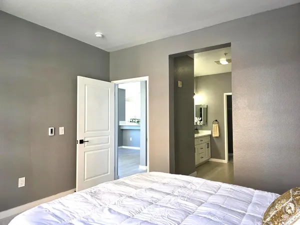 a bedroom with a bed and closet