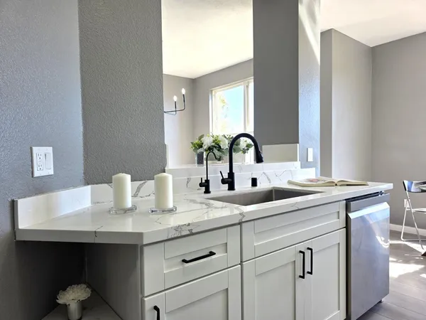 a bathroom with a sink and a mirror