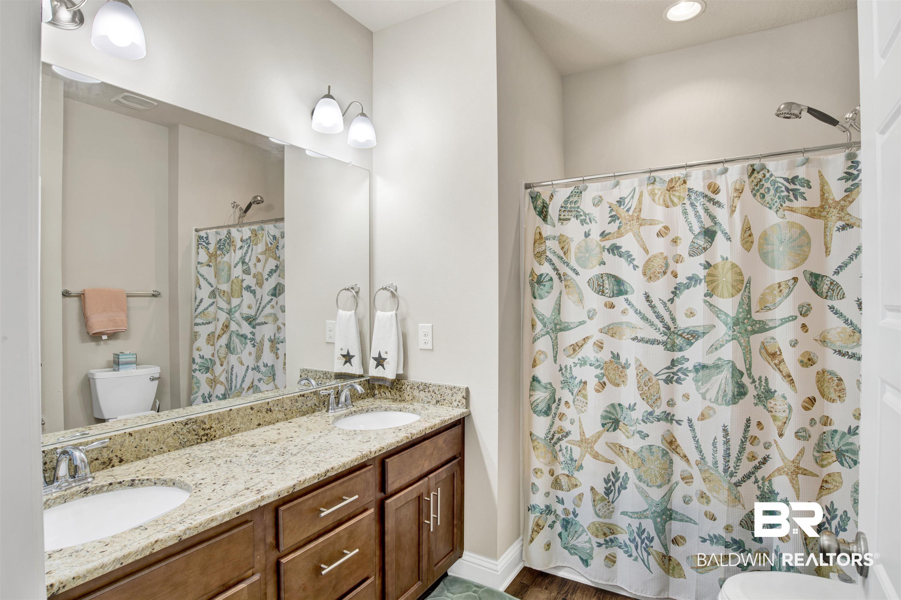 278 Silo Loop Fairhope, AL 36532 - Photo 17 of 26 Full bath featuring a shower with shower curtain and double vanity