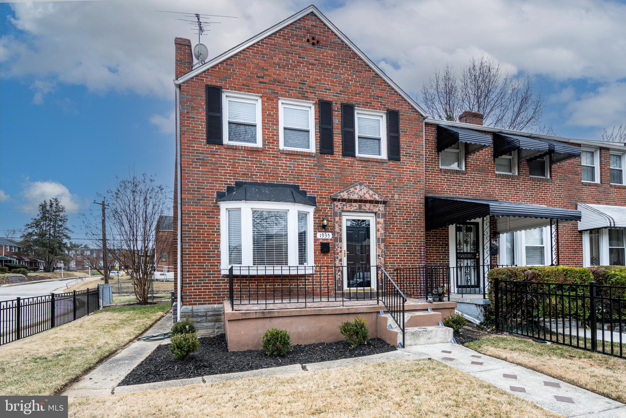 1935 Ramblewood Road Baltimore, MD 21239 - Photo 1 of 37 a front view of a house with garden