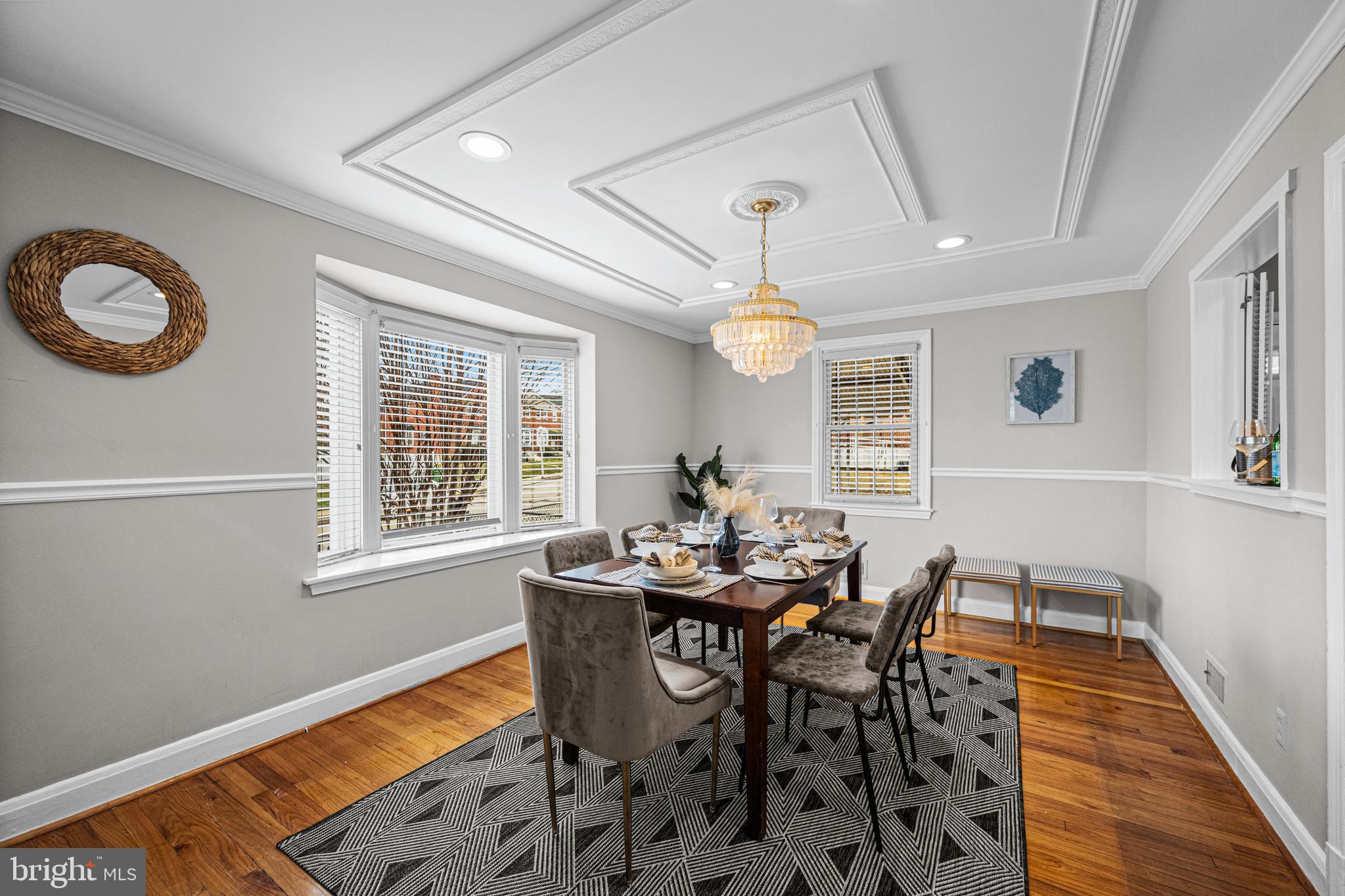 1935 Ramblewood Road Baltimore, MD 21239 - Photo 12 of 37 a view of a dining room with furniture and a chandelier