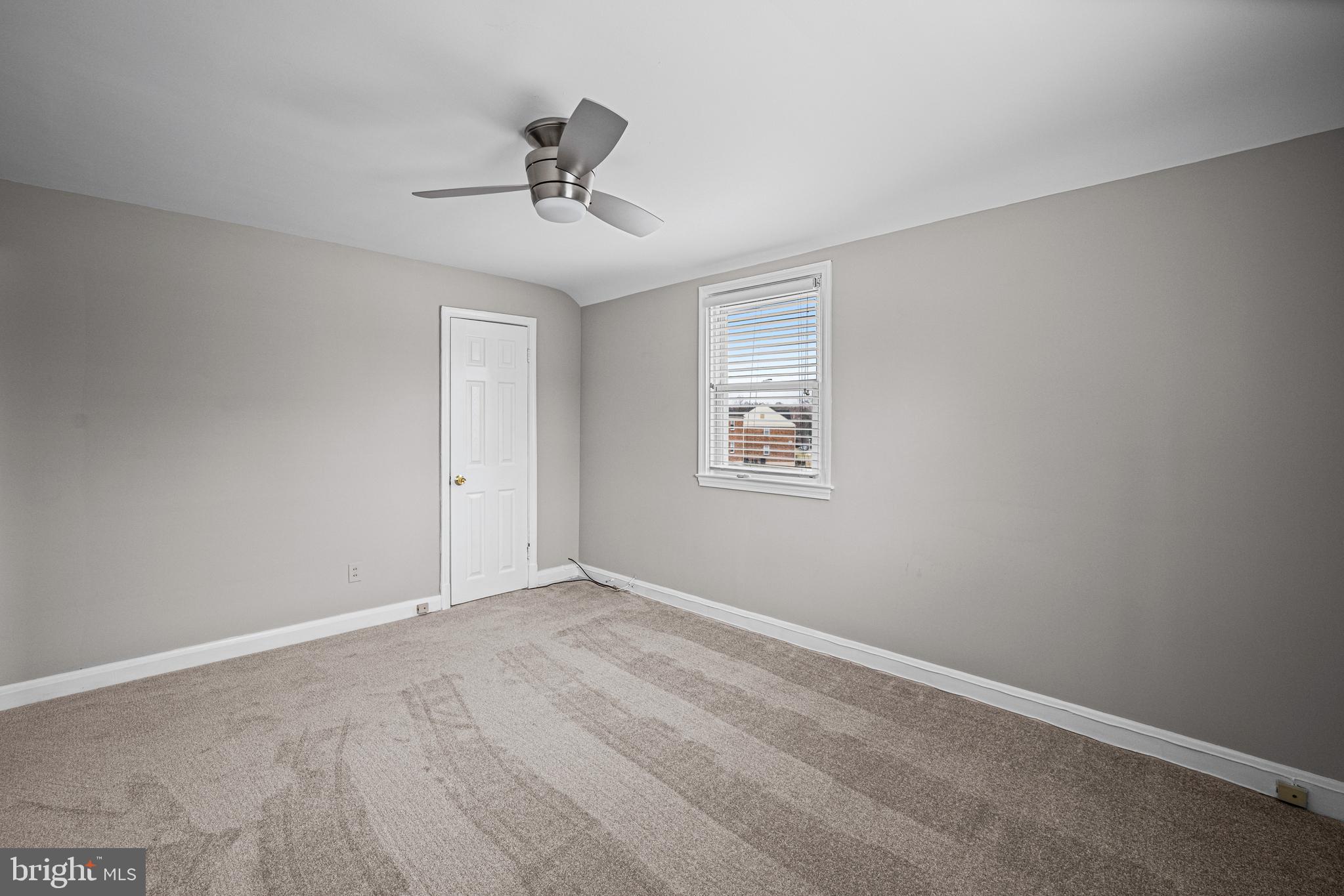 1935 Ramblewood Road Baltimore, MD 21239 - Photo 15 of 37 a view of an empty room with a window