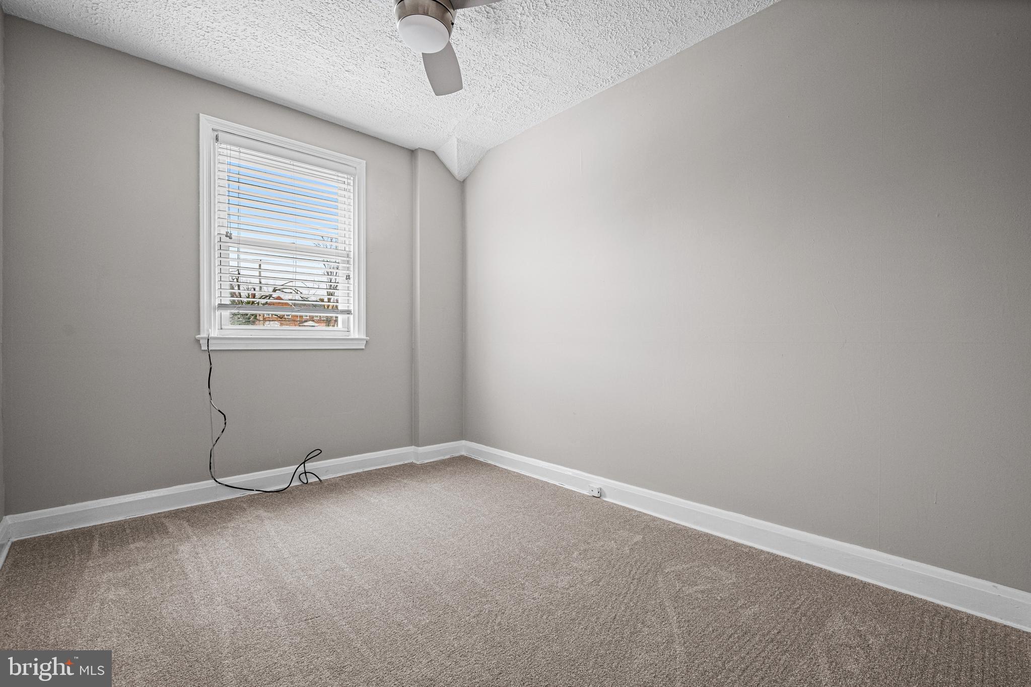 1935 Ramblewood Road Baltimore, MD 21239 - Photo 16 of 37 an empty room with a window