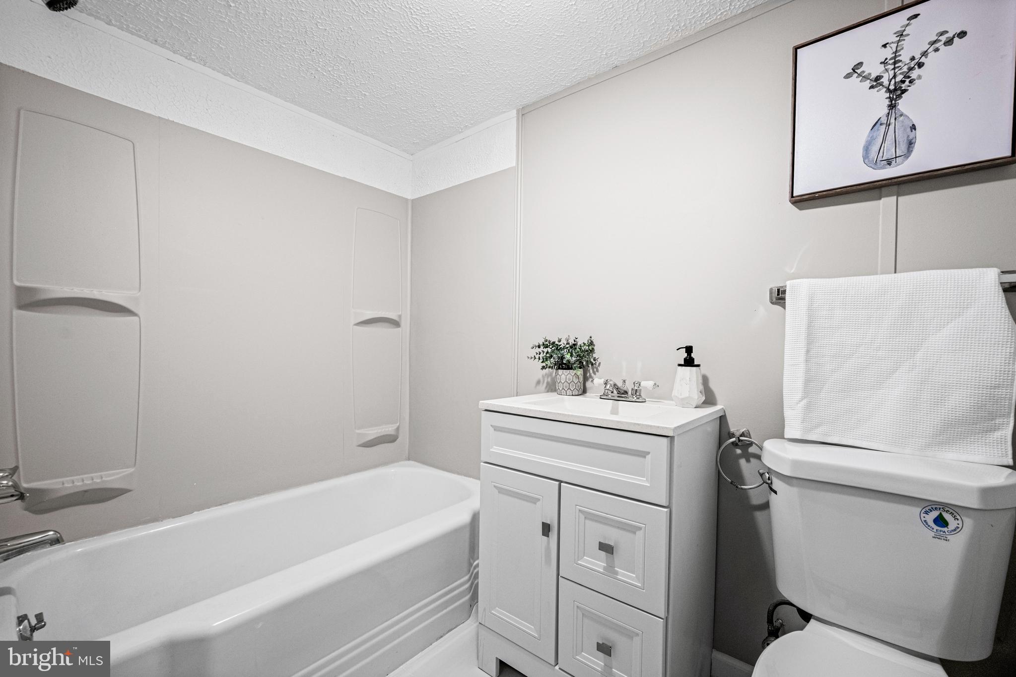 1935 Ramblewood Road Baltimore, MD 21239 - Photo 25 of 37 a bathroom with a sink toilet and tub