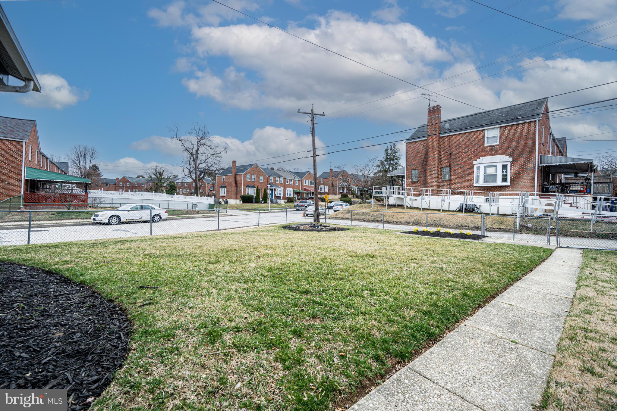 1935 Ramblewood Road Baltimore, MD 21239 - Photo 31 of 37 a swimming pool with outdoor seating and yard