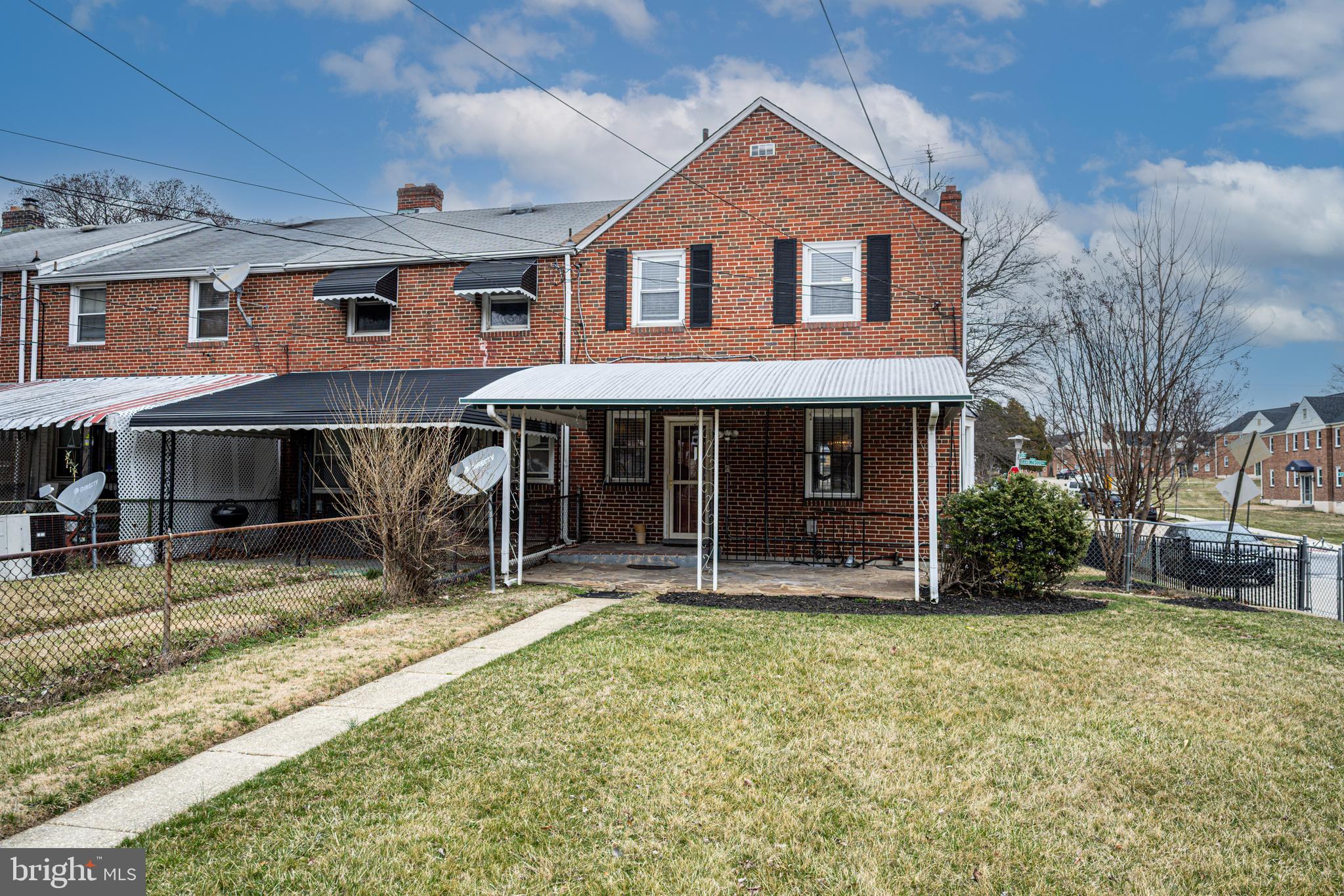 1935 Ramblewood Road Baltimore, MD 21239 - Photo 33 of 37 a front view of a house with garden