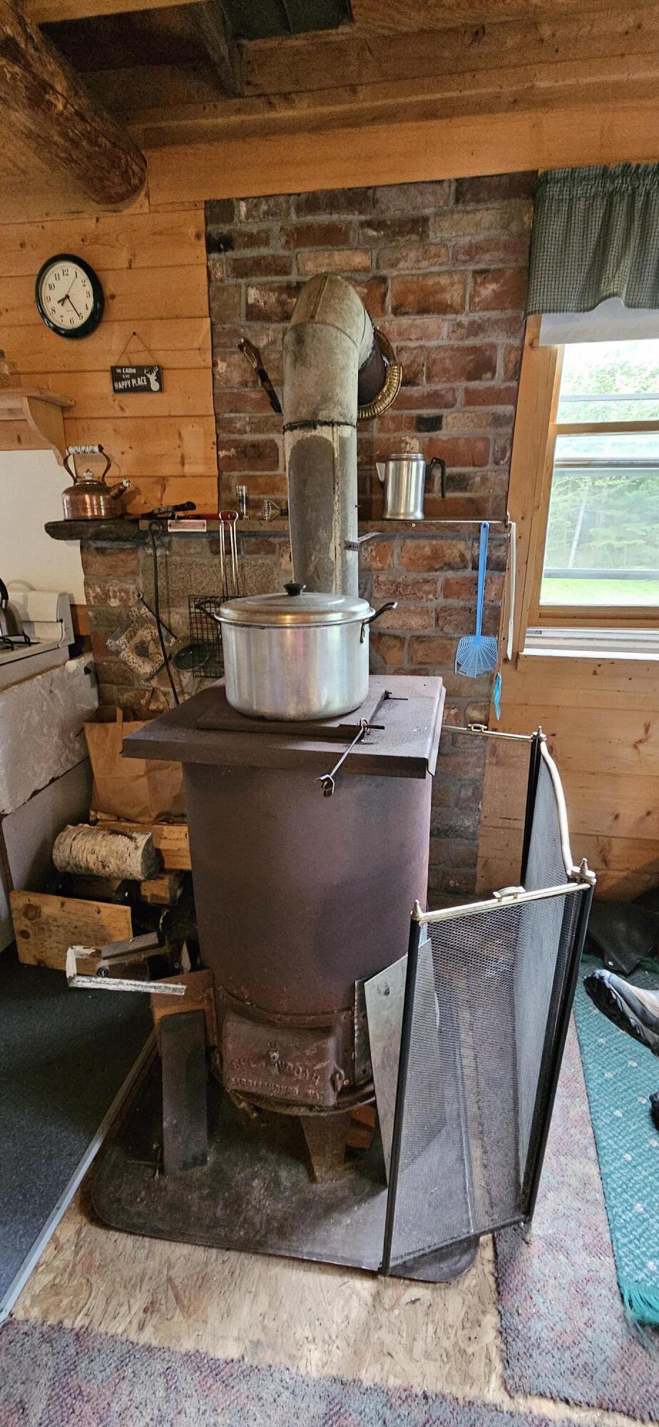 1112 East B Hill Road Upton, ME 04261 - Photo 9 of 39 Wood stove in kitchen