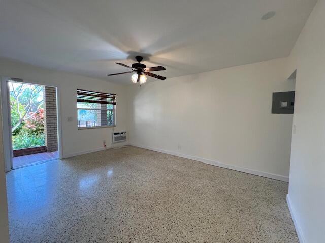 311 Inlet Way, Unit 10 Palm Beach Shores, FL 33404 - Photo 8 of 18 an empty room with windows and ceiling fan