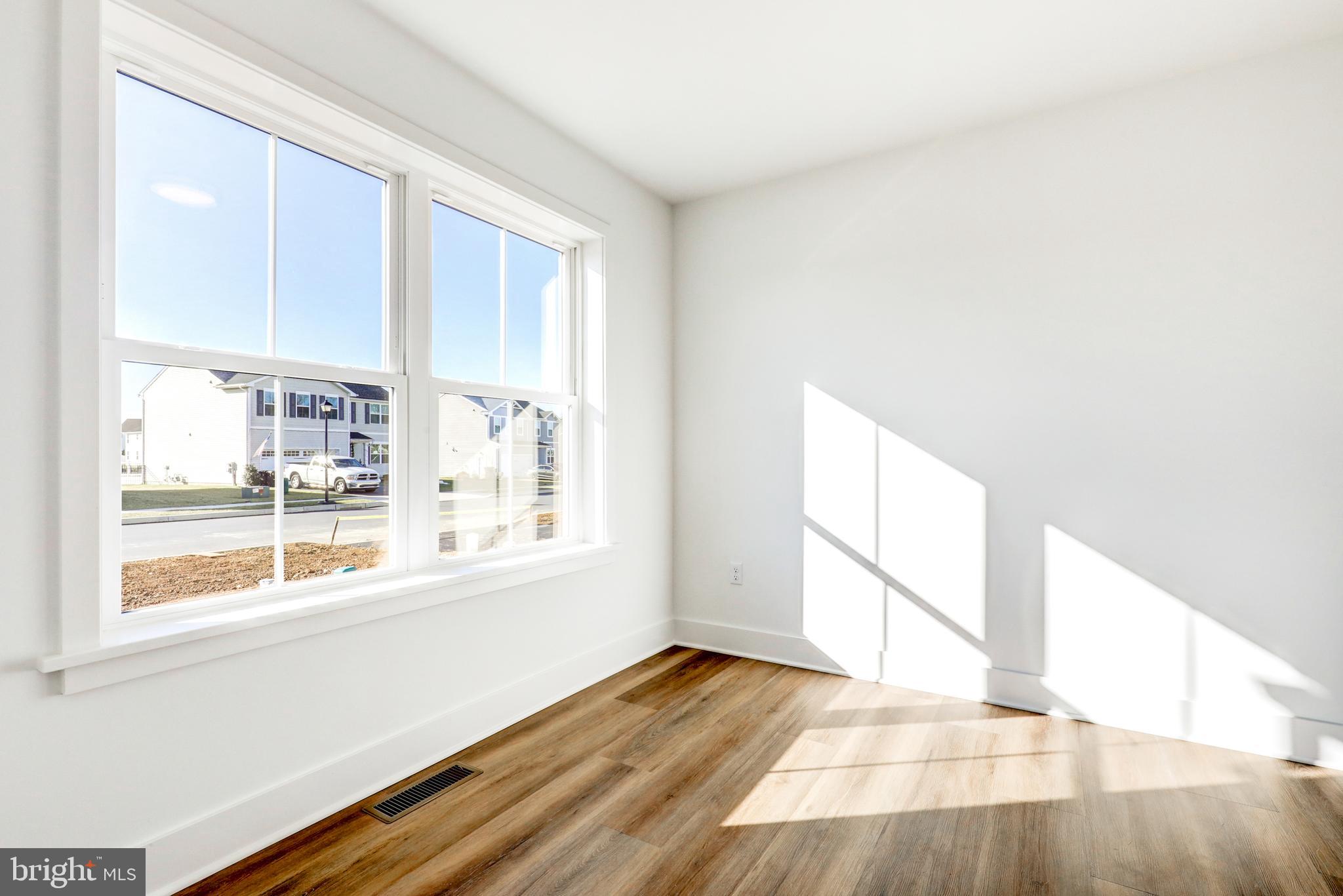 223 Coffee Goss Road Marietta, PA 17547 - Photo 11 of 19 a view of an empty room with wooden floor and a window