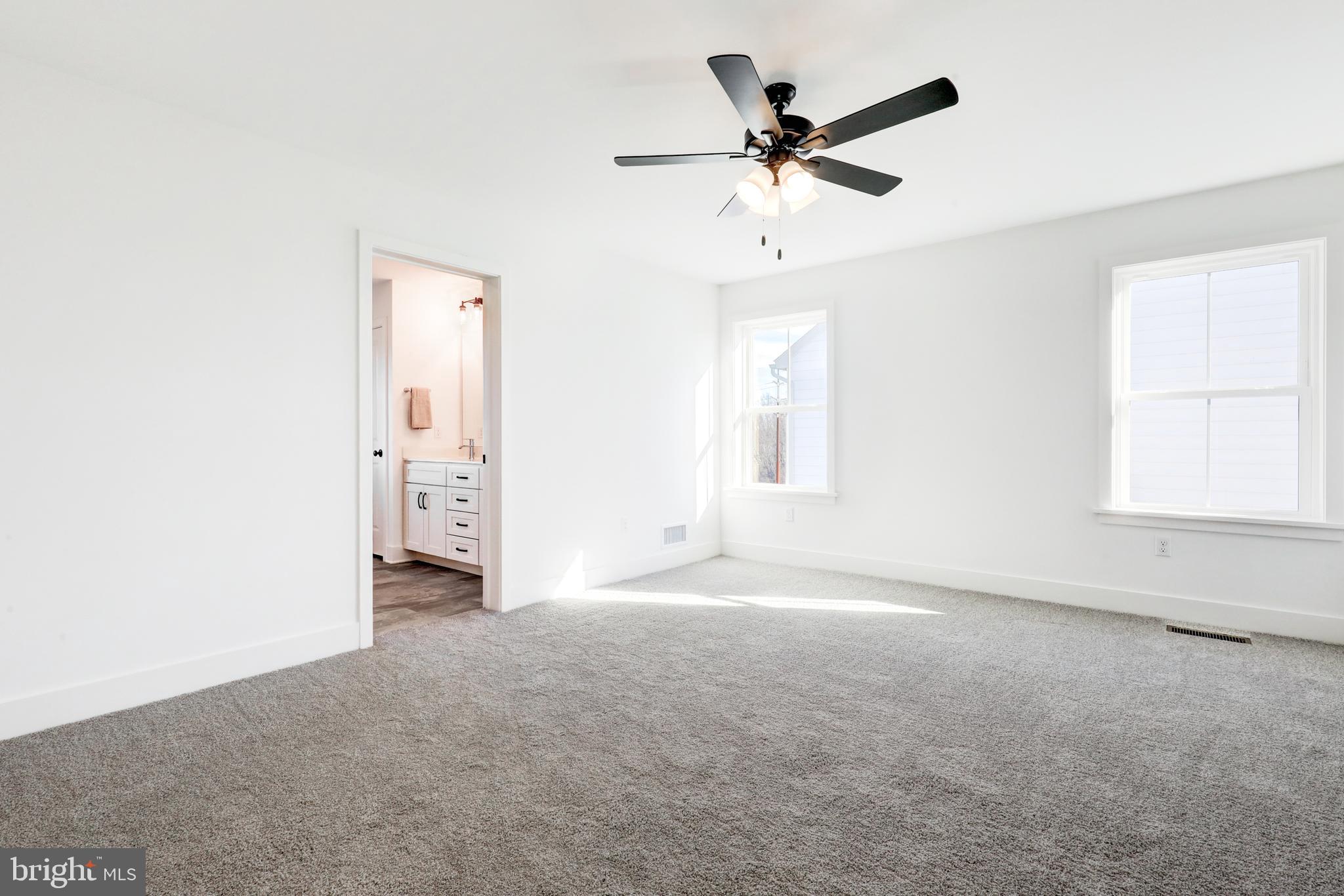 223 Coffee Goss Road Marietta, PA 17547 - Photo 13 of 19 a view of a livingroom with a ceiling fan and window