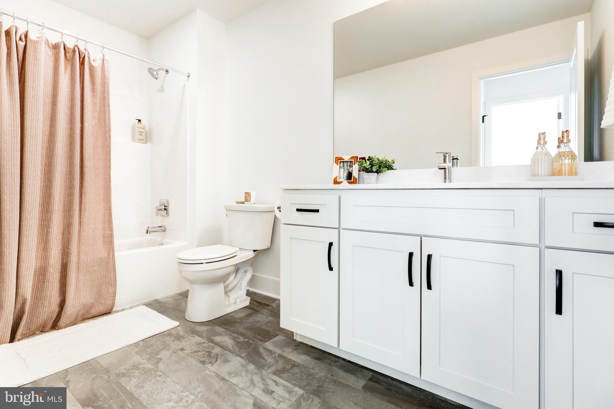 223 Coffee Goss Road Marietta, PA 17547 - Photo 16 of 19 a bathroom with a white toilet sitting next to a bathroom sink