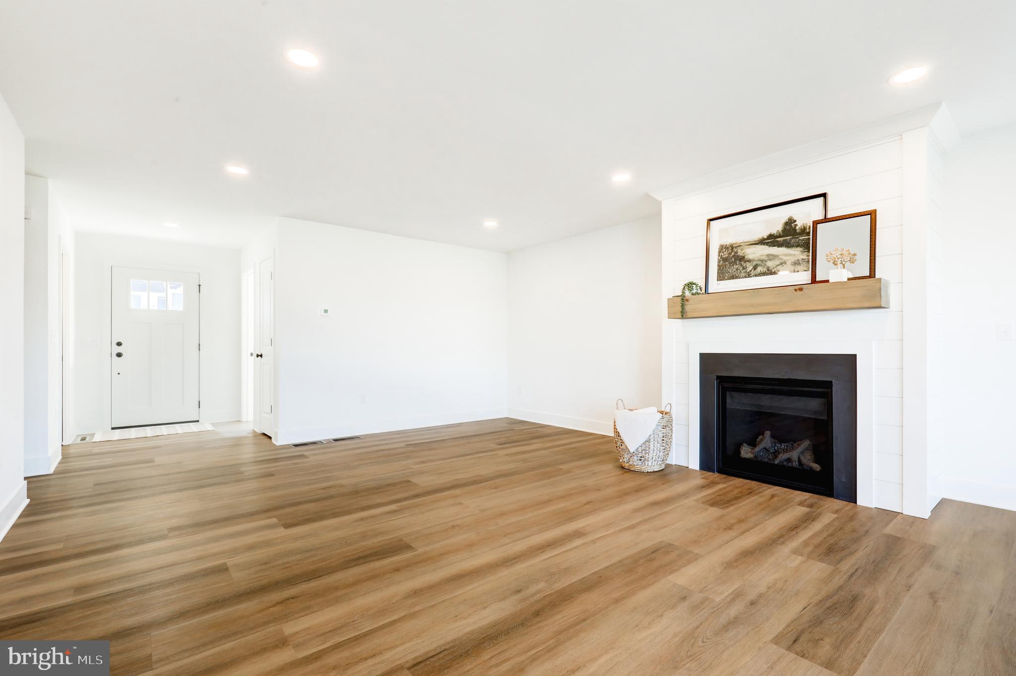 223 Coffee Goss Road Marietta, PA 17547 - Photo 5 of 19 a bedroom with a bed and a fireplace