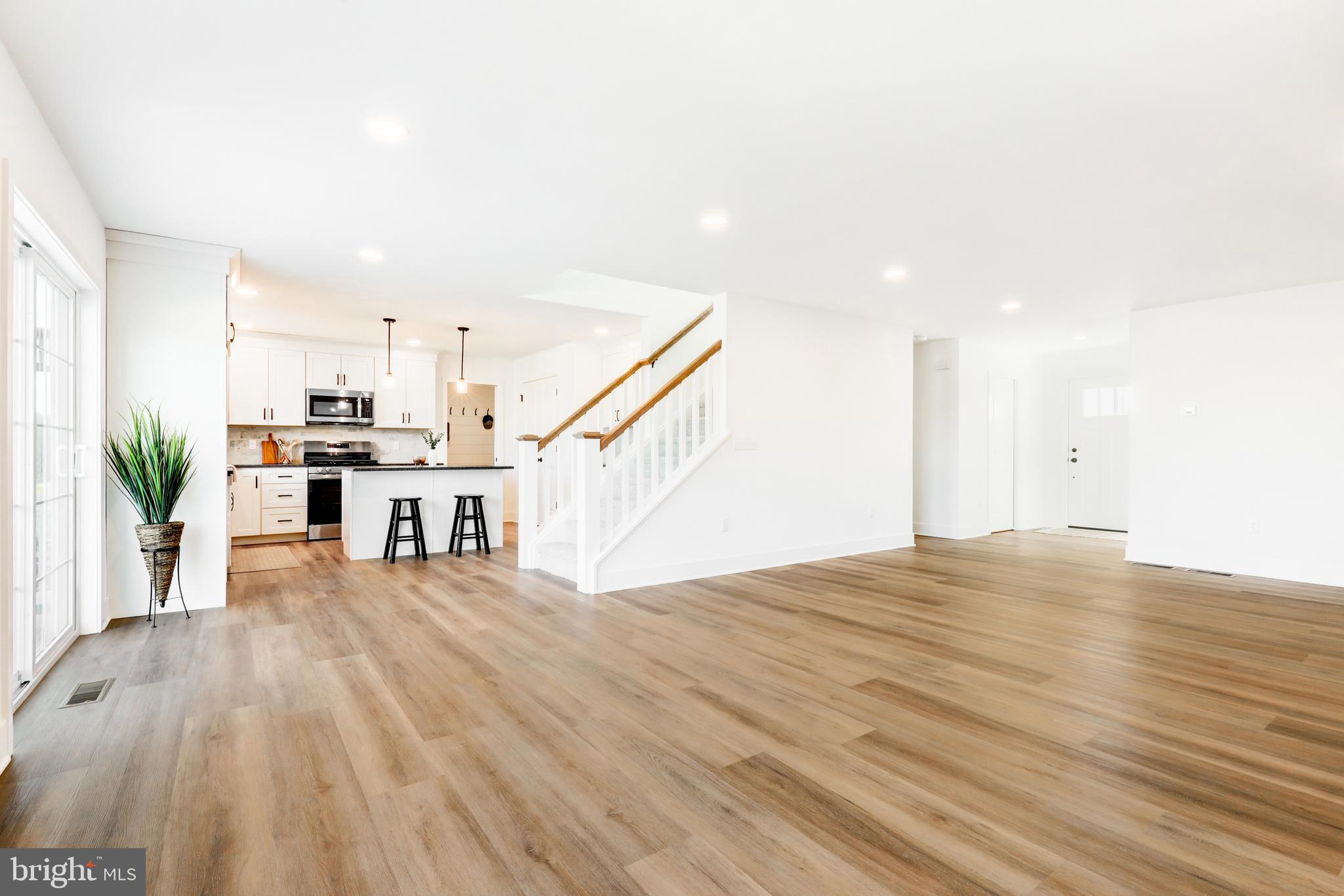 223 Coffee Goss Road Marietta, PA 17547 - Photo 6 of 19 a view of a kitchen with furniture and wooden floor