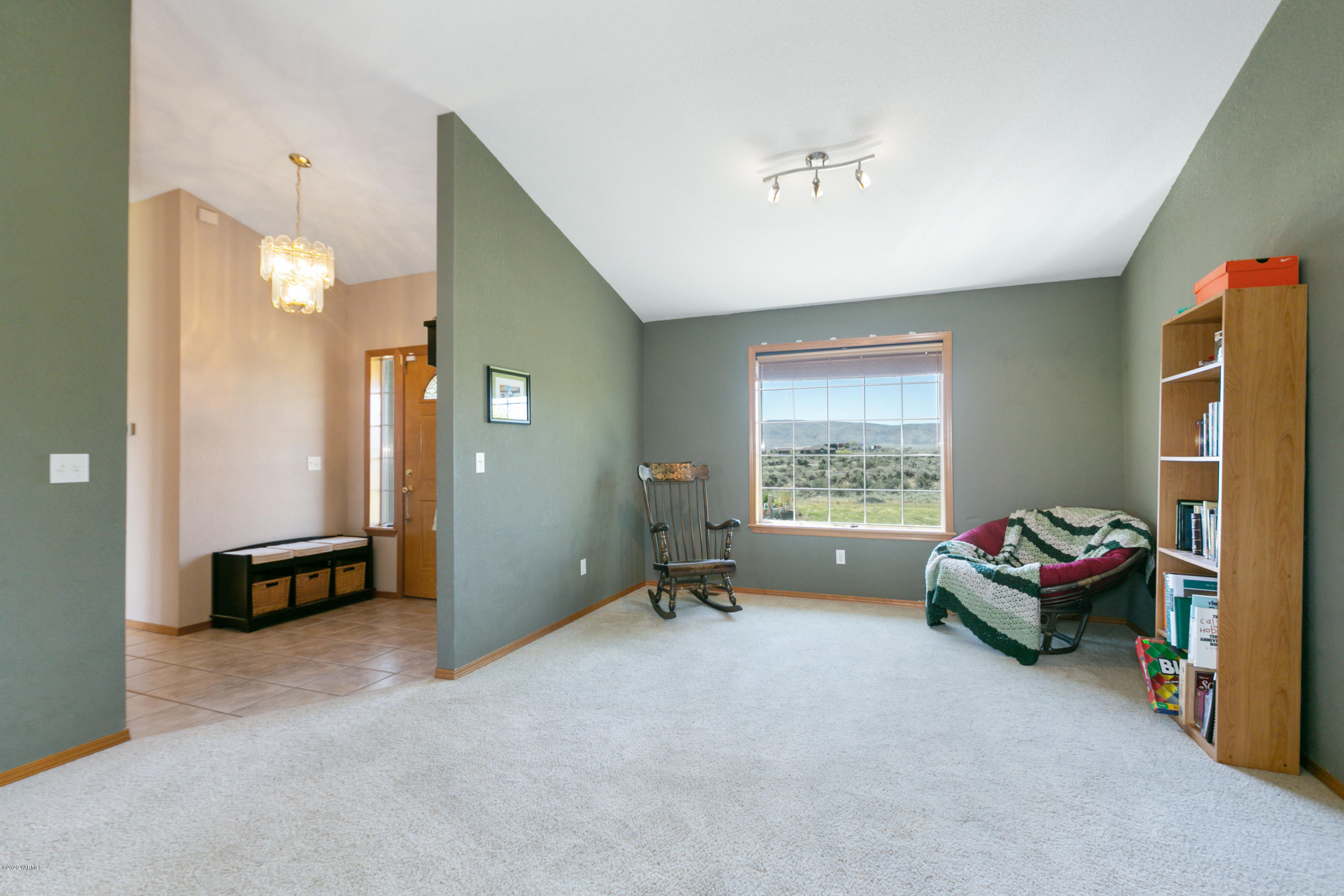681 Red Tail Road Yakima, WA 98908 - Photo 7 of 21 a living room with a bed furniture and a window