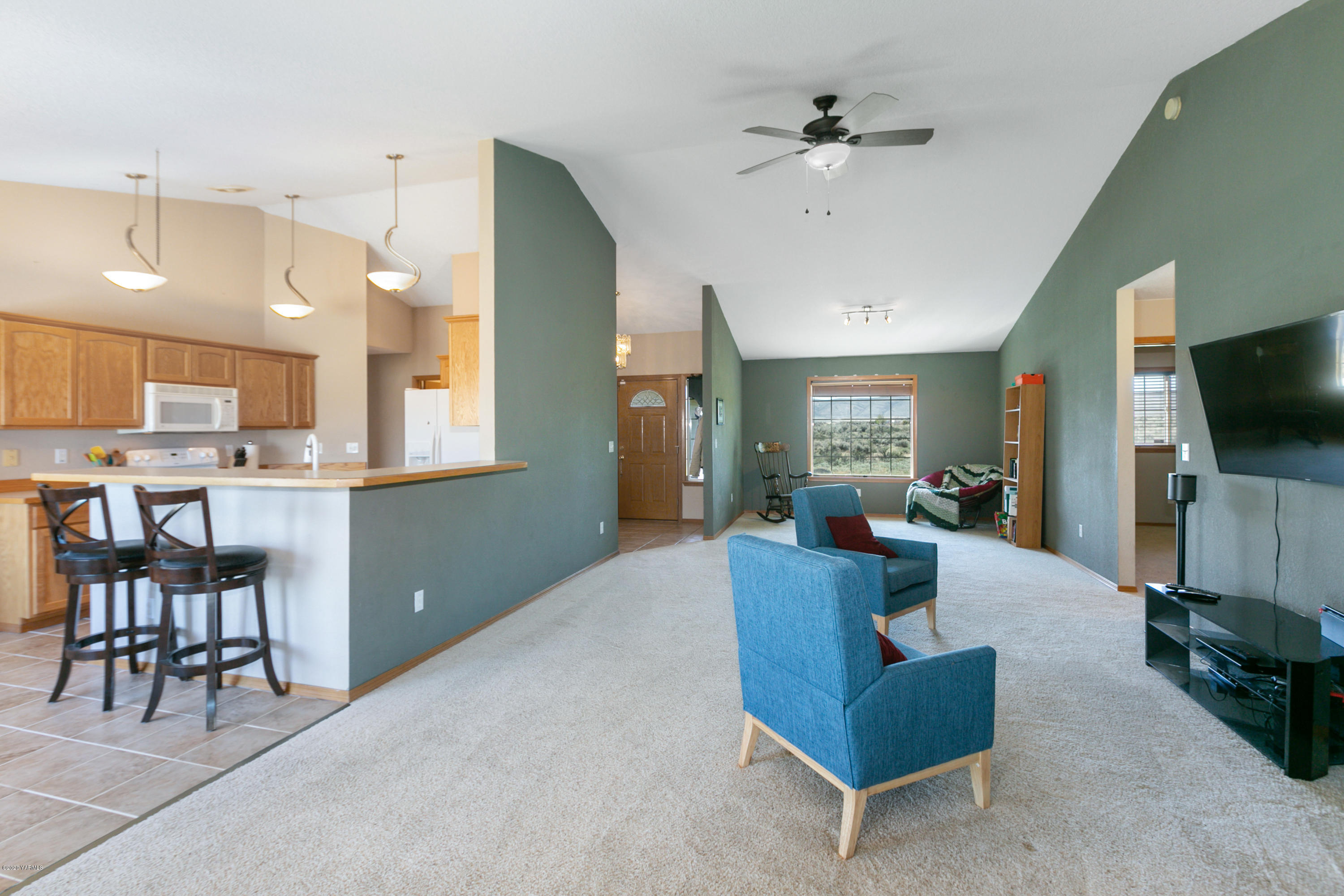 681 Red Tail Road Yakima, WA 98908 - Photo 9 of 21 a living room with furniture and a flat screen tv