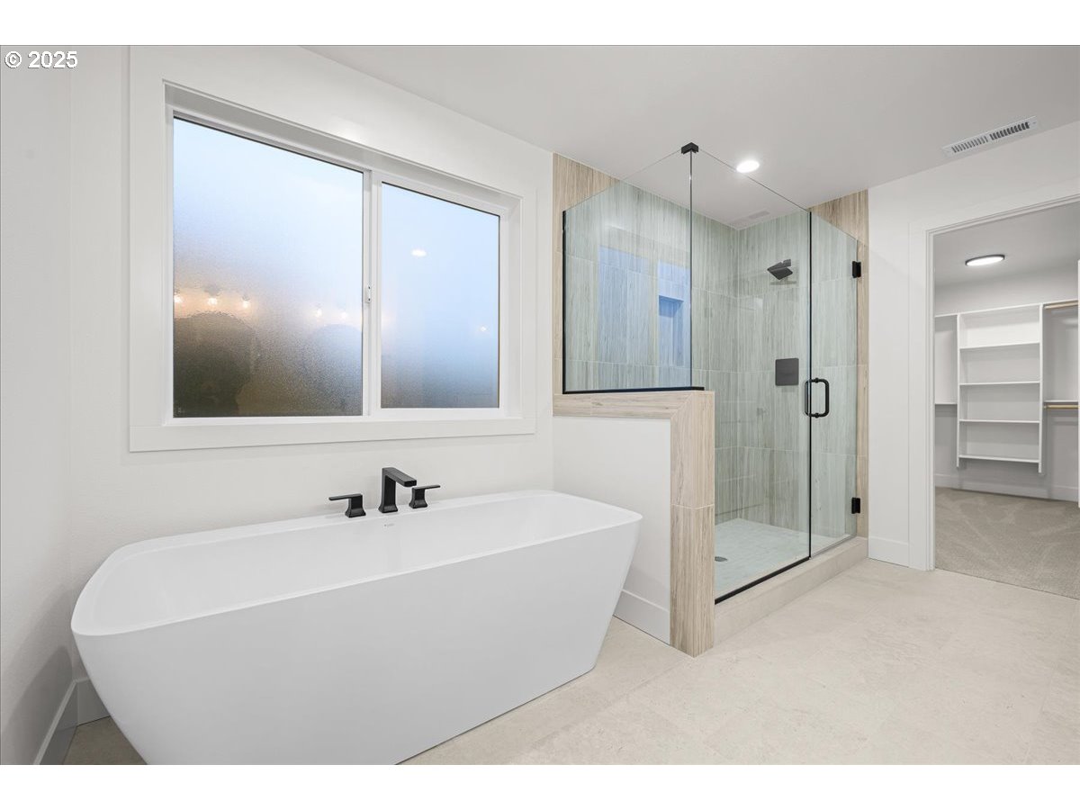 3518 North 11th Circle Ridgefield, WA 98642 - Photo 29 of 44 a bathroom with a sink a shower and a mirror