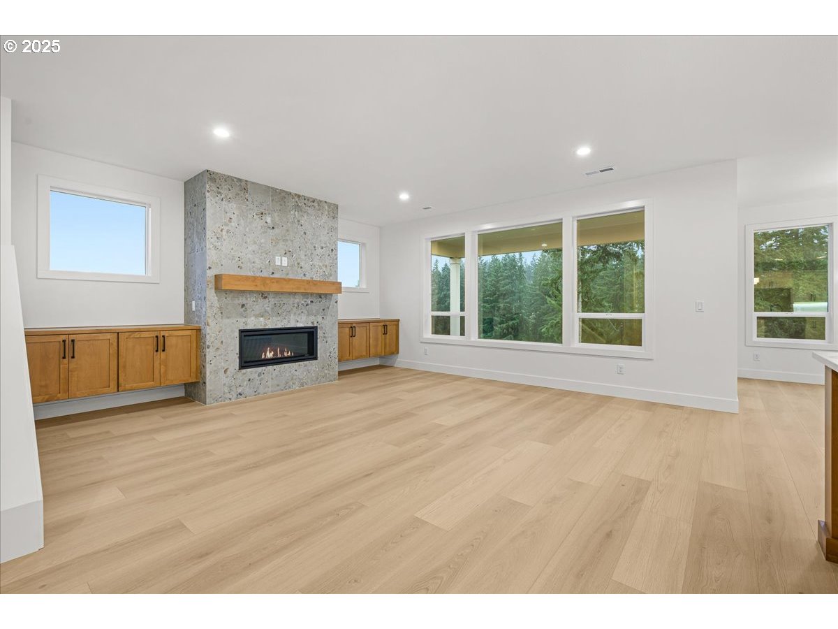 3518 North 11th Circle Ridgefield, WA 98642 - Photo 6 of 44 a view of empty room with furniture and a fireplace