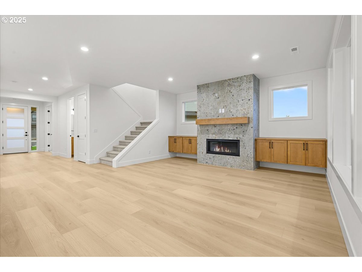 3518 North 11th Circle Ridgefield, WA 98642 - Photo 8 of 44 a view of kitchen and hall with wooden floor