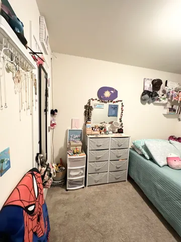 a bedroom with furniture and a bed