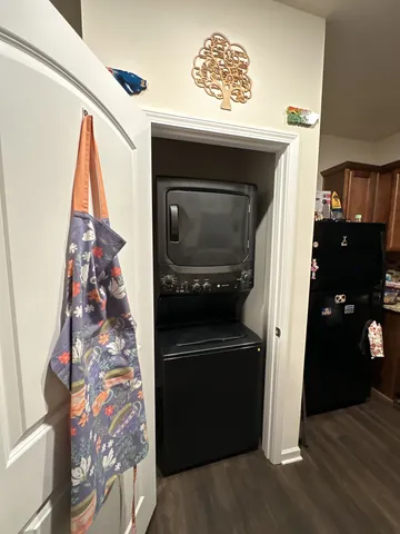 a view of a hallway and wooden floor with entryway