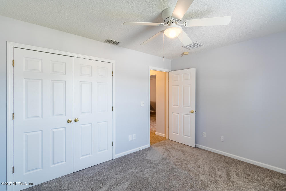 13290 Pacemaker Drive Jacksonville, FL 32225 - Photo 24 of 40 an empty room with fan