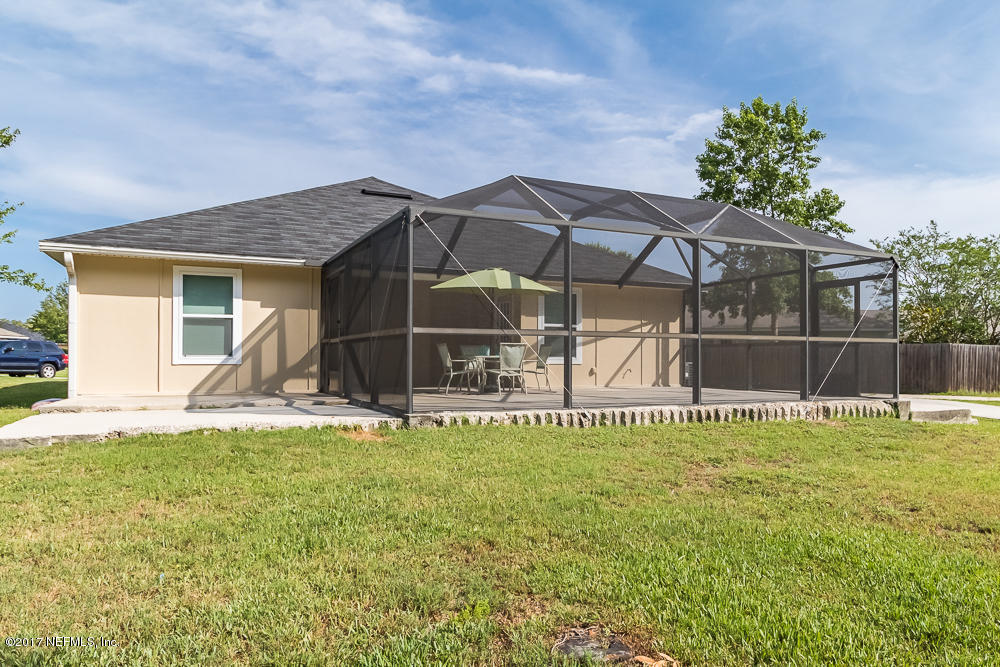 13290 Pacemaker Drive Jacksonville, FL 32225 - Photo 29 of 40 a view of a house with a yard and sitting area