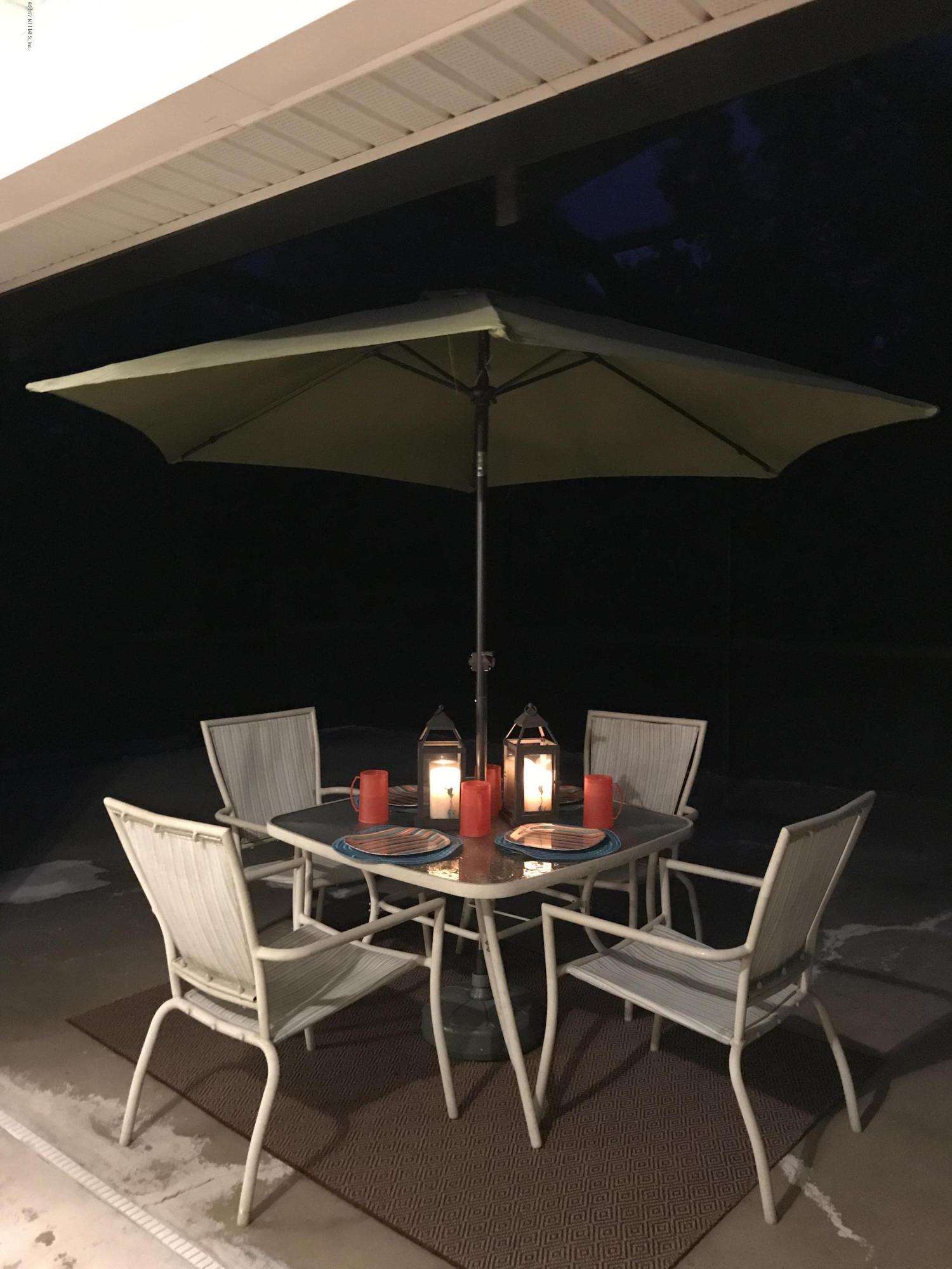 13290 Pacemaker Drive Jacksonville, FL 32225 - Photo 34 of 40 a view of chair and table in wooden floor
