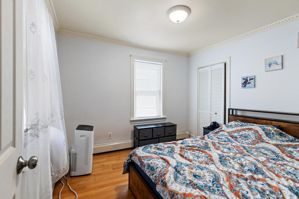 81 Everett Street Everett, MA 02149 - Photo 23 of 37 a bedroom with a bed and a window