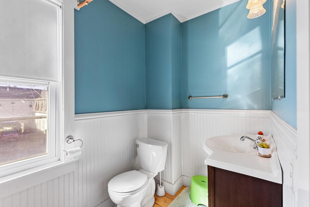 81 Everett Street Everett, MA 02149 - Photo 28 of 37 a white toilet sitting next to a bathroom sink