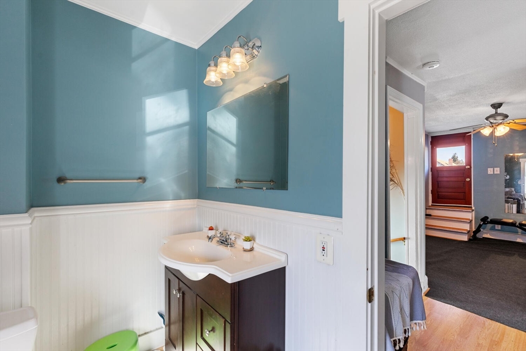 81 Everett Street Everett, MA 02149 - Photo 29 of 37 a bathroom with a sink a mirror and a shower