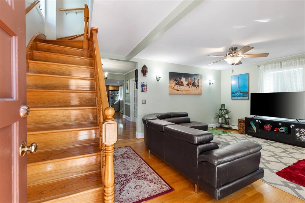 81 Everett Street Everett, MA 02149 - Photo 7 of 37 a living room with furniture and a flat screen tv